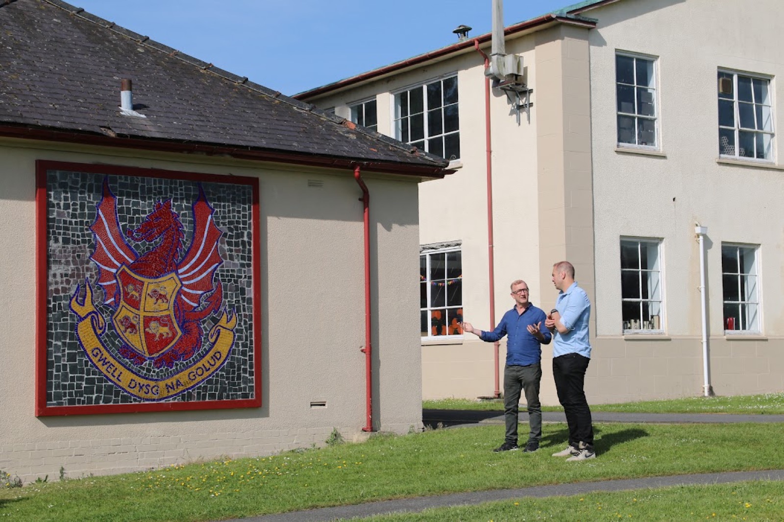 The crest mosaic on the College walls