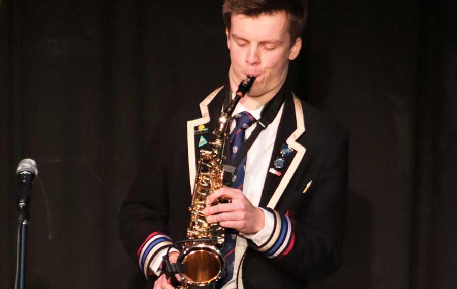 A pupil performing on saxophone
